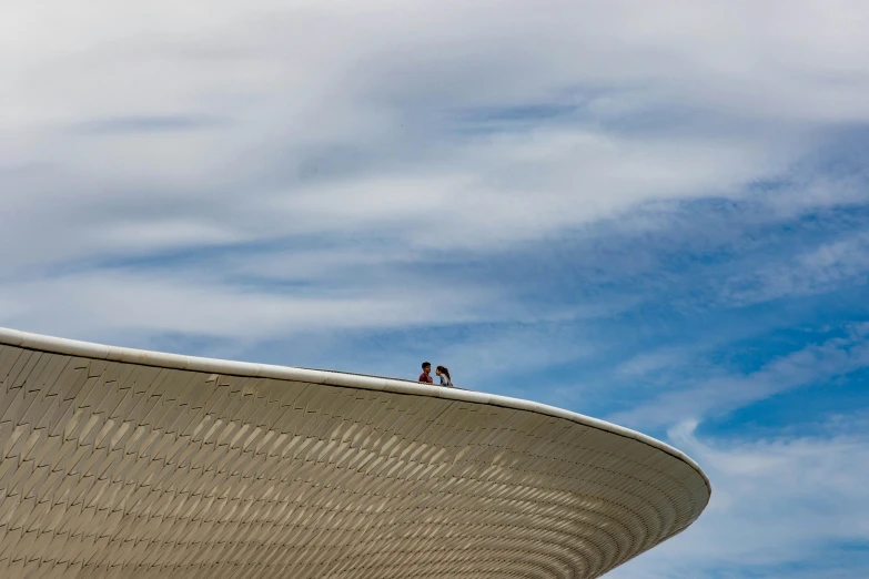 a couple is walking next to the roof