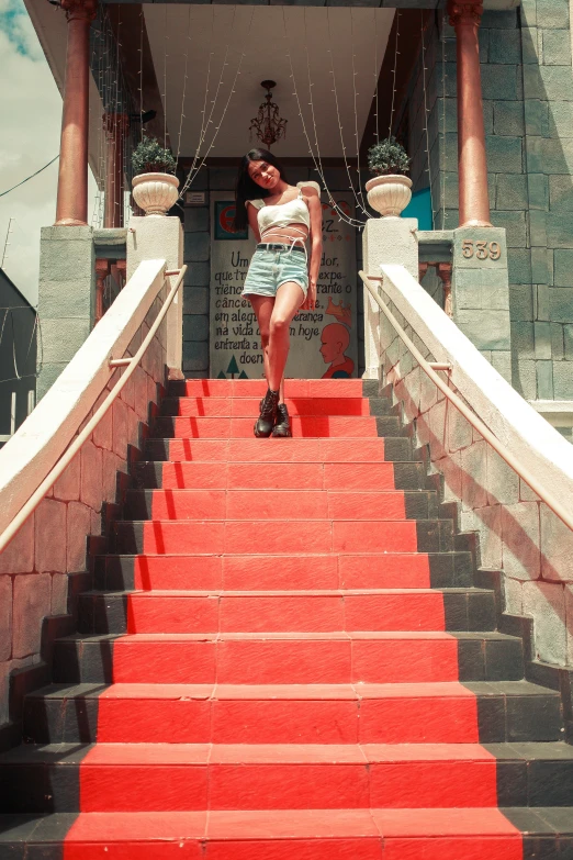 the girl is walking down the steps of the temple