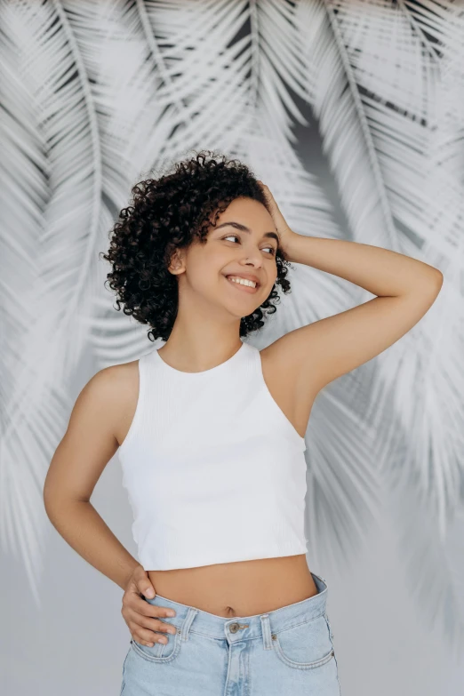 a beautiful woman wearing a white tank top