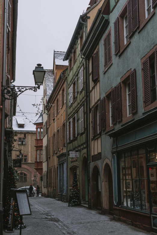 narrow alleyway in an old town during the christmas season