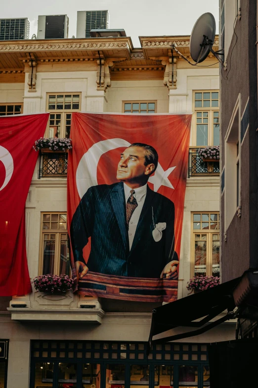 flags surrounding the flag depicting the president of turkey