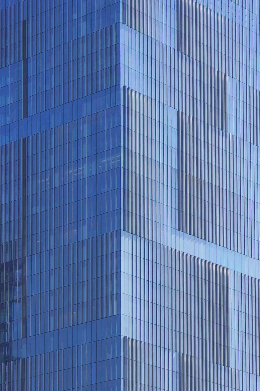 two airplanes are flying in the sky beside a large building