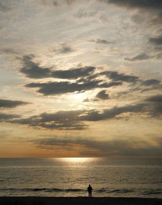 a person on the shore line with the ocean