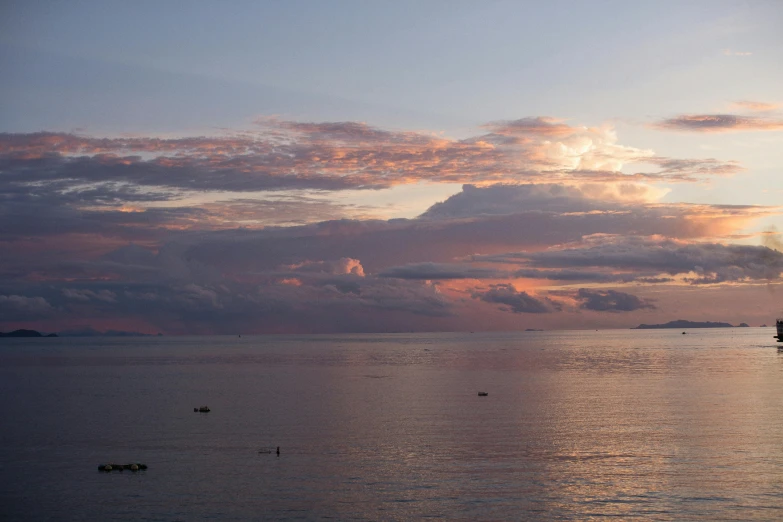 a boat sailing in the middle of a large body of water