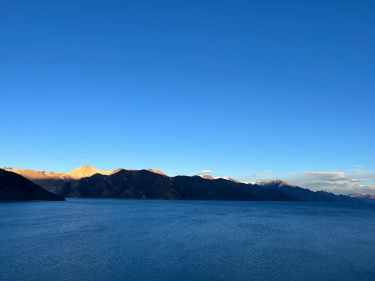 a view of mountains and a body of water