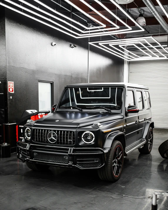 a jeep parked in a large dark garage