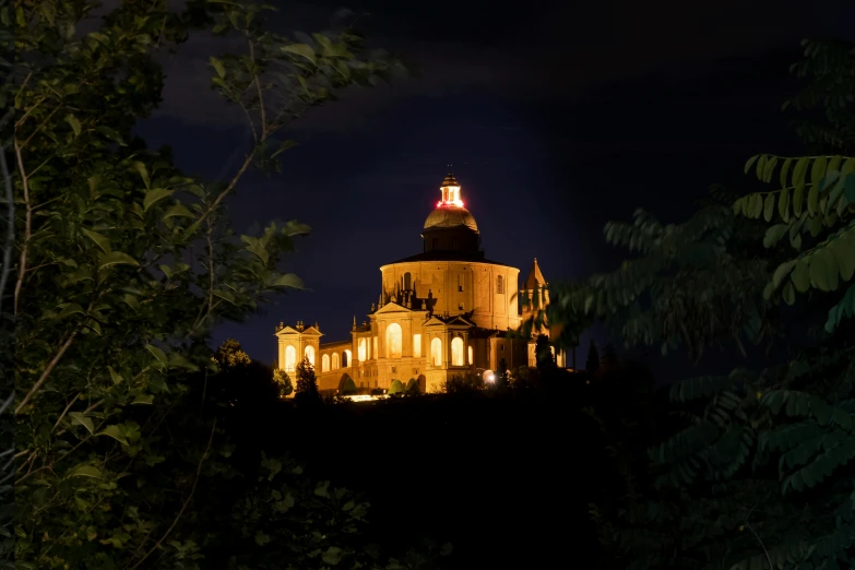 there is a large building that is glowing up at night