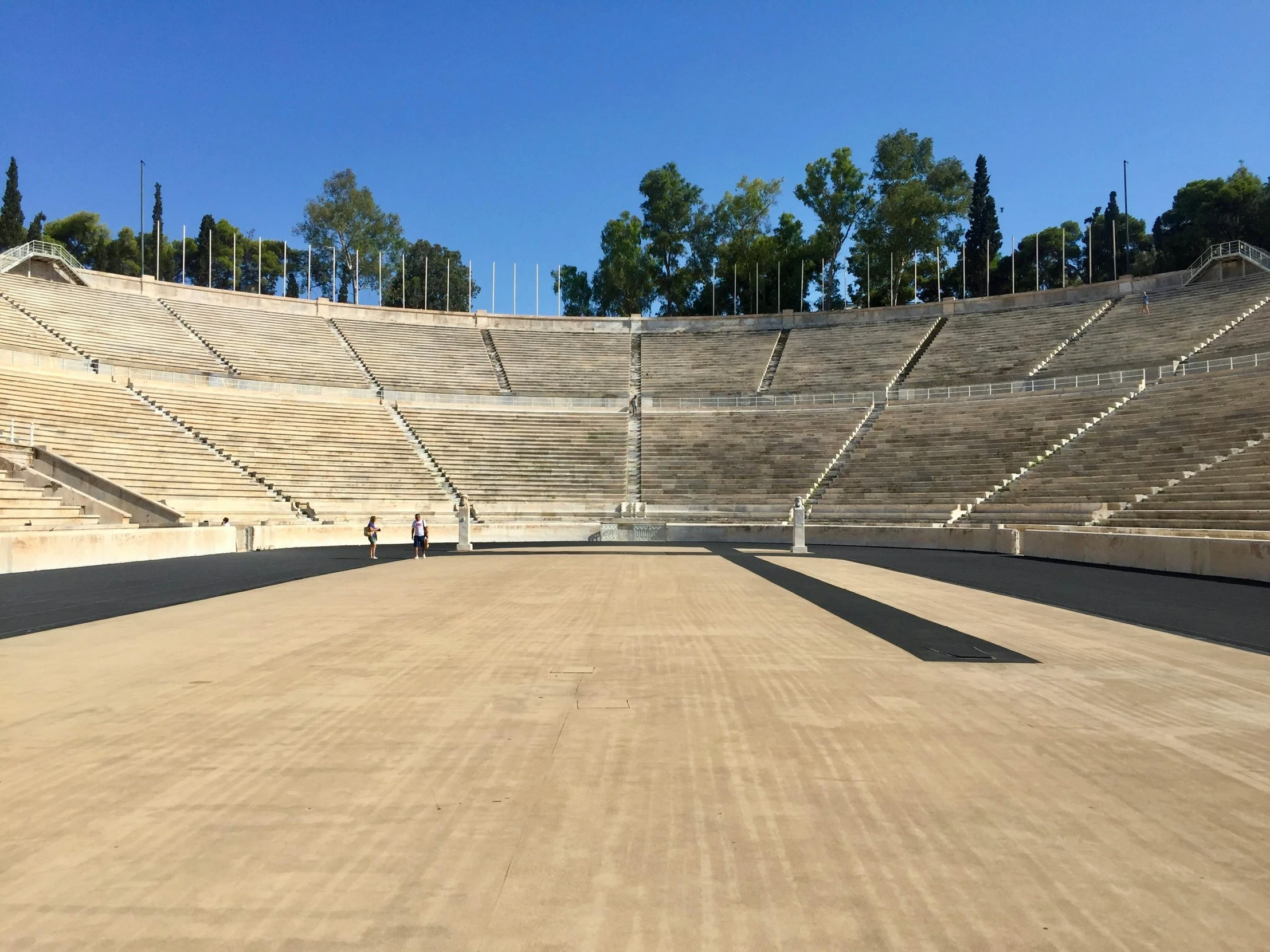 an empty tennis court in a stadium is shown