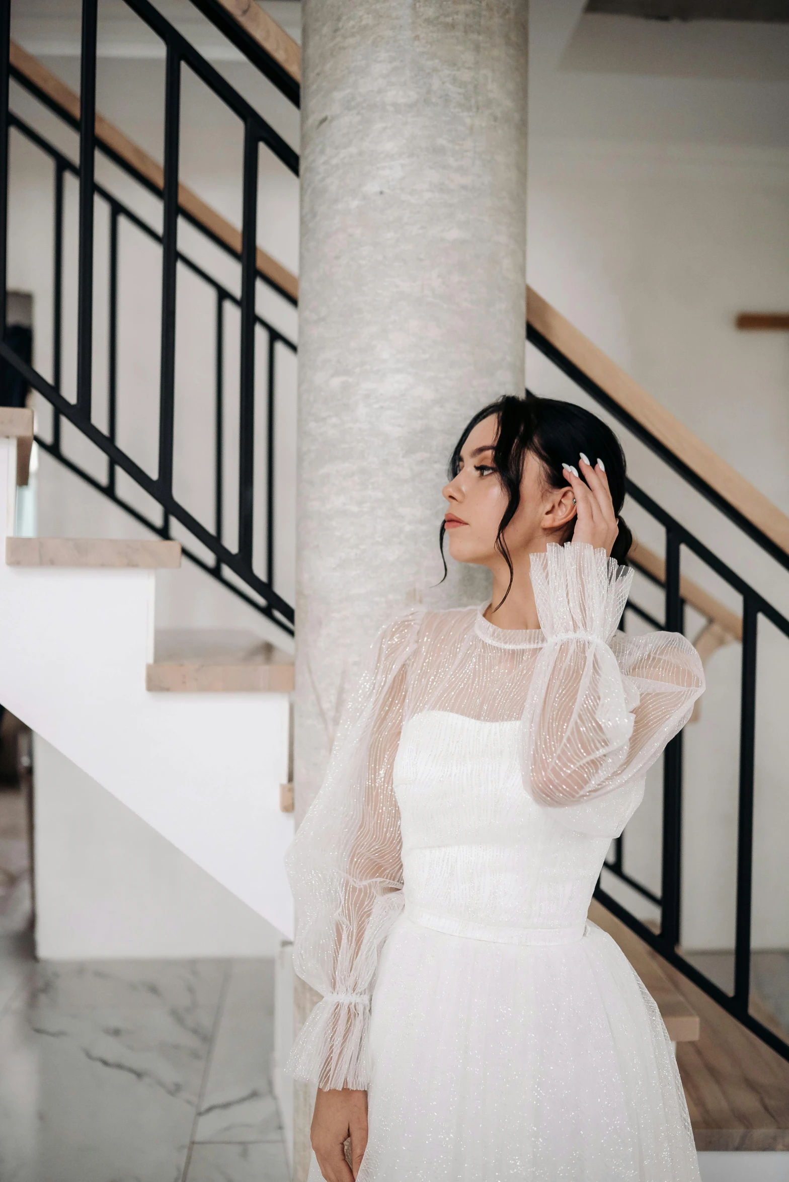 the bride is wearing a white wedding dress