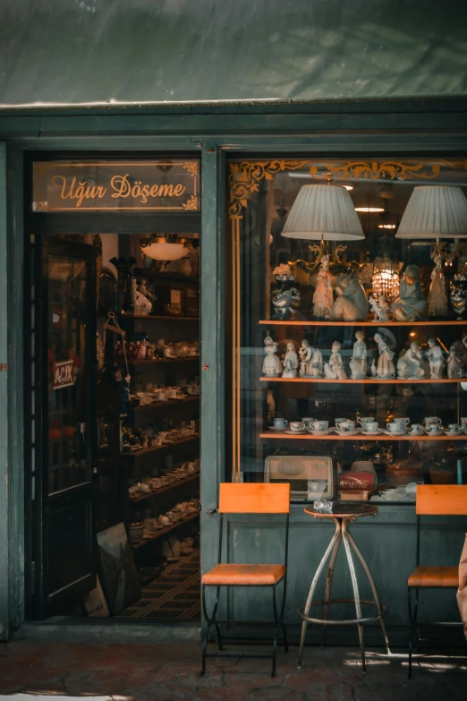 an old storefront has antiques for sale in the window