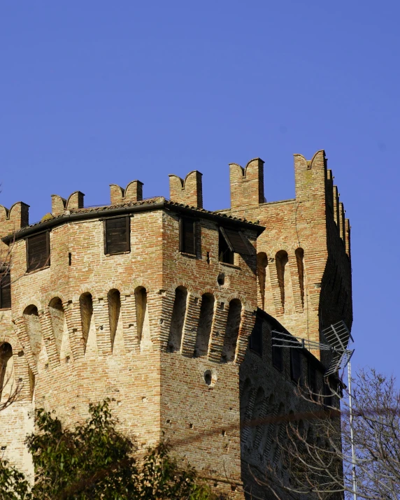 a very tall brick building with many windows