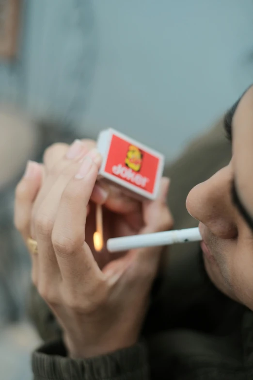 a man smoking a cigarette with his mouth open