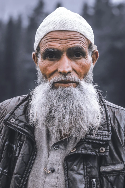 an old man with a big long beard and an evil look on his face