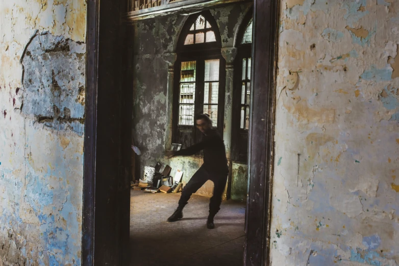 a person is in an old building with a mirror