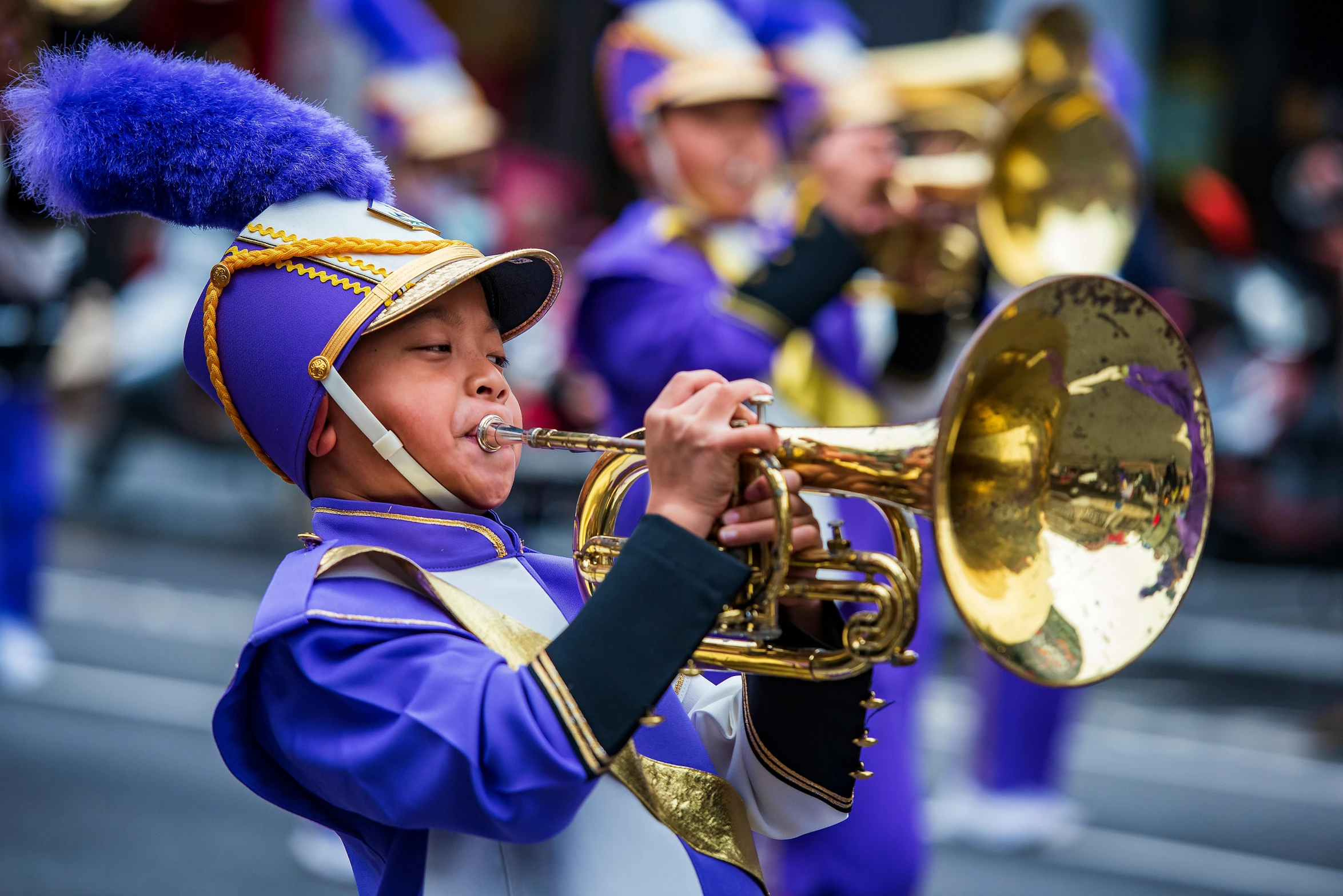 a woman playing the trumpet during the parade