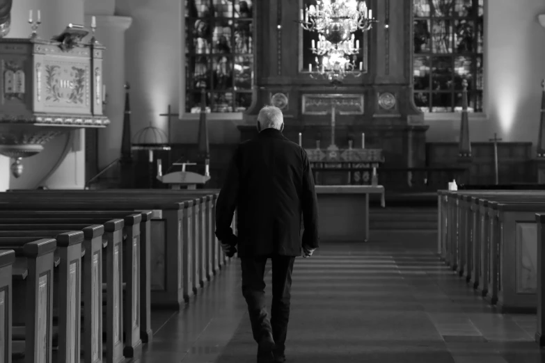 man walking away from the altar in a church