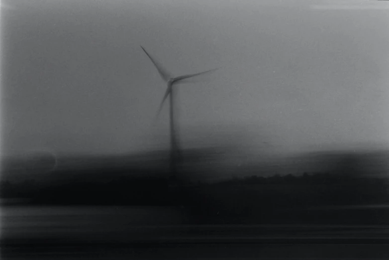 an abstract po of wind farm windmill in the fog