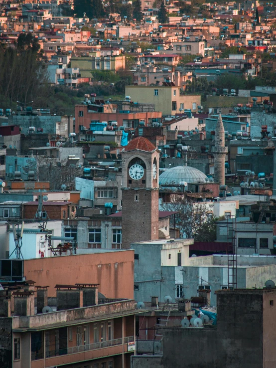 a very big clock tower above the city skyline