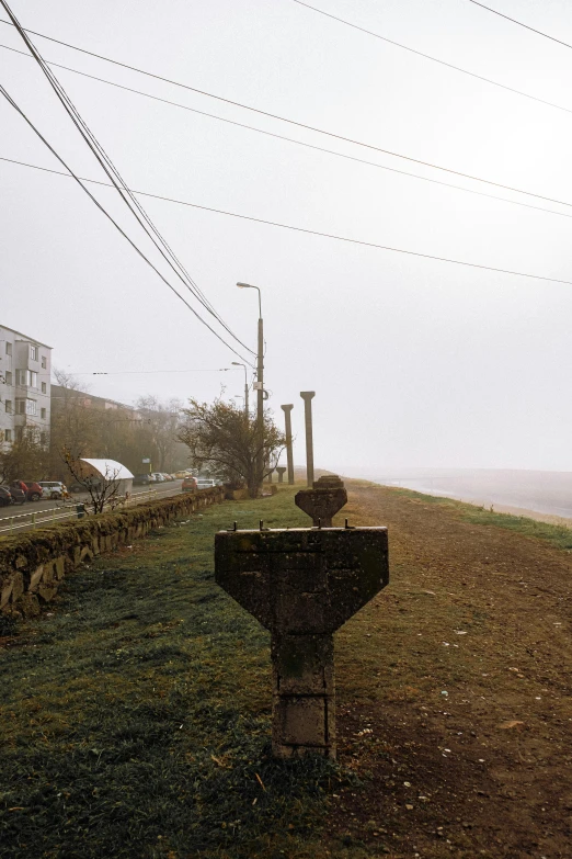 a large sign sits on top of the hill