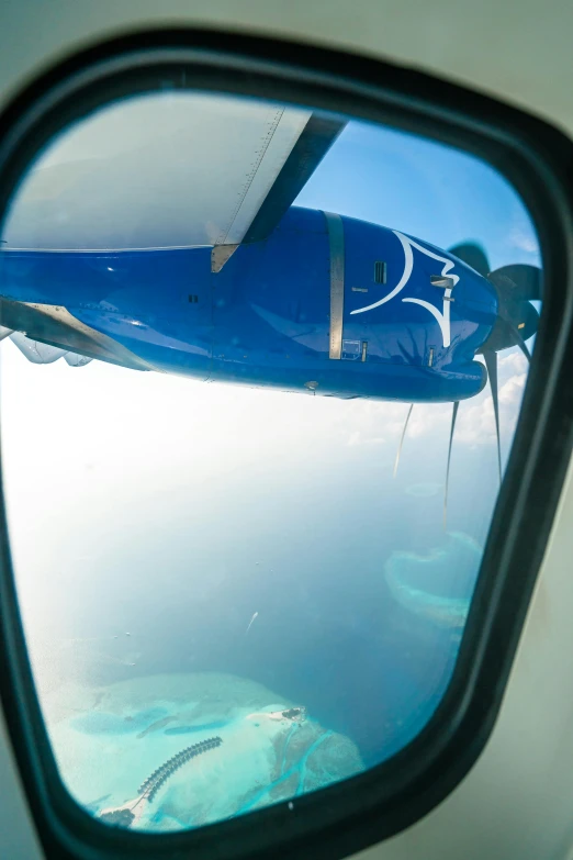 the wing of an airplane flying high in the air