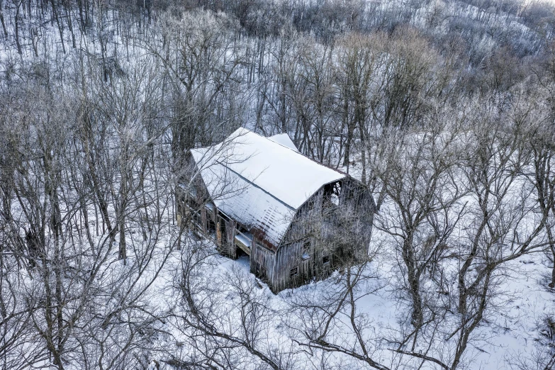 an old shack in the middle of the winter