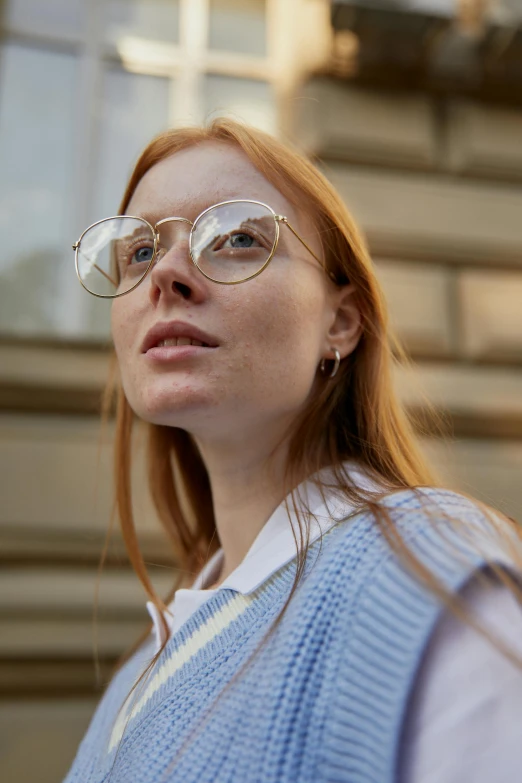 a woman wearing some kind of glasses and looking up