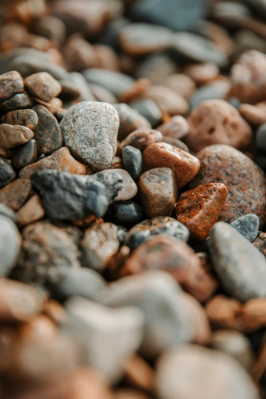 many different rocks are placed together on the ground