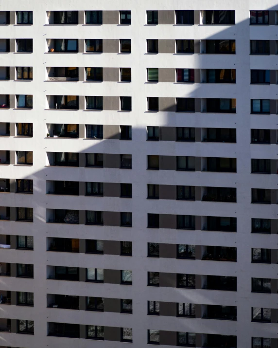 shadows of a white building are cast on the side