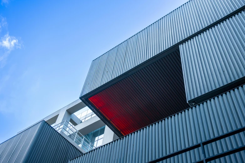 tall buildings that have red lights and a glass window on each