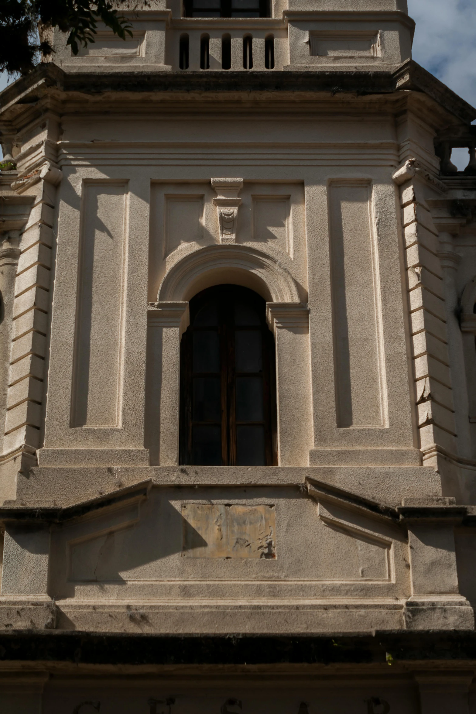 the tower of the building has an arched door