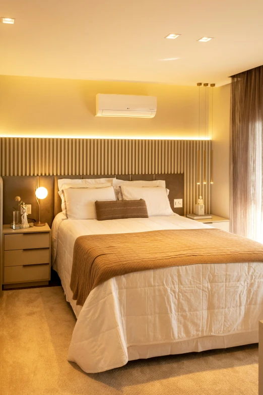 a bed sitting under a window in a bedroom