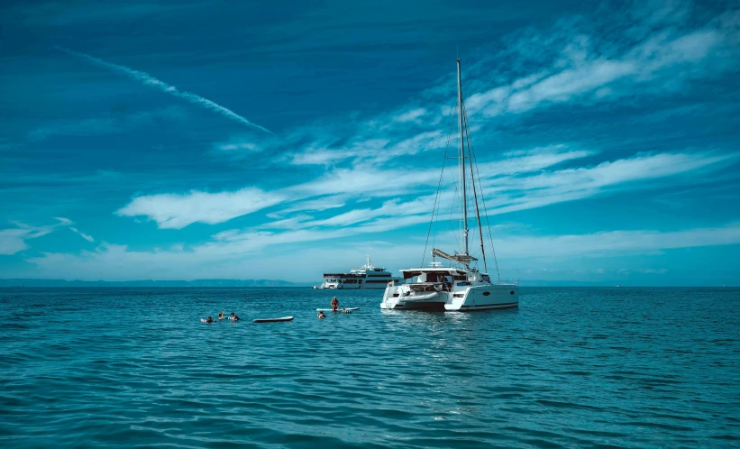 a group of small boats floating in a large body of water