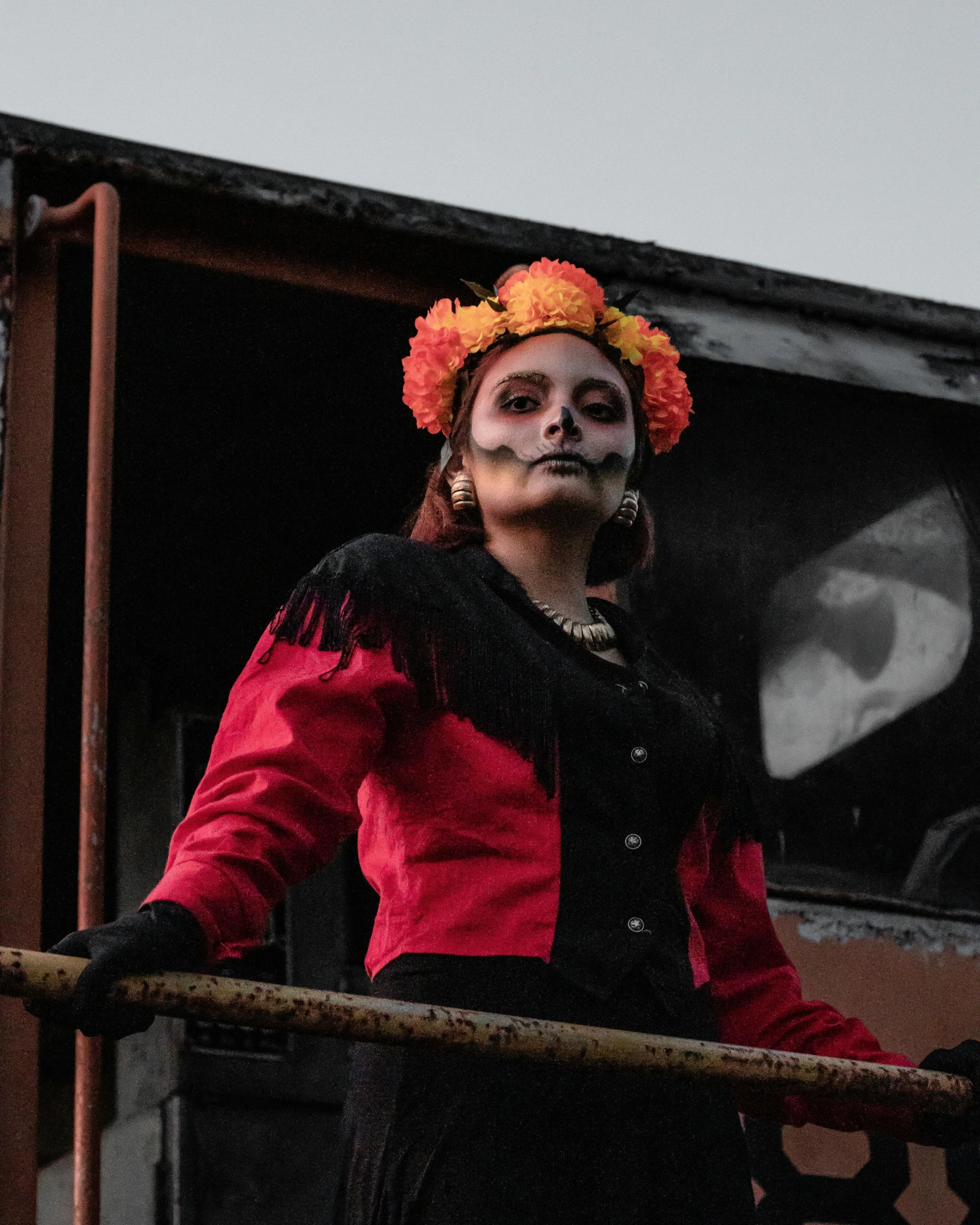 a woman wearing white makeup and face paint