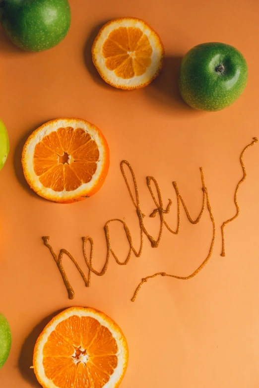fresh fruit is laid out in the words made with oranges