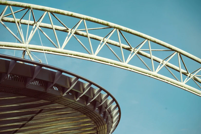 a large metal bridge spanning high into the sky