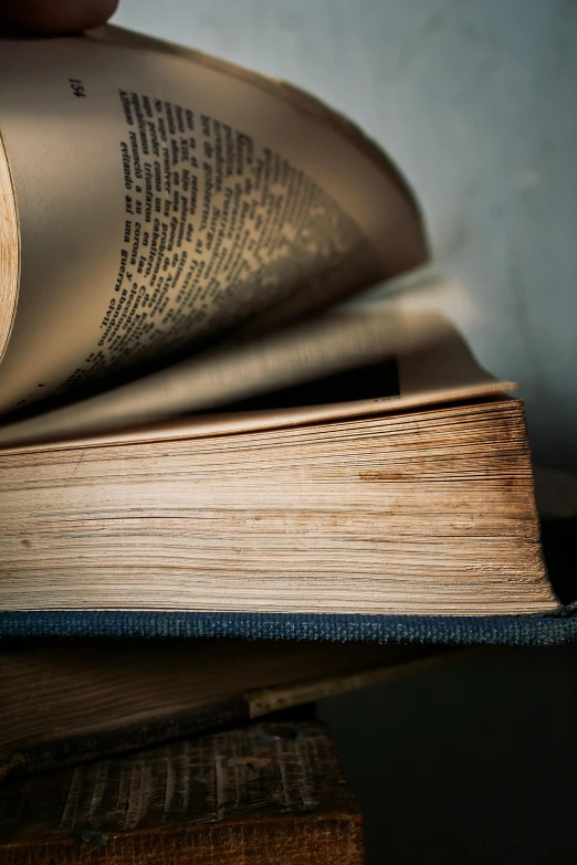 two books open and resting on a table