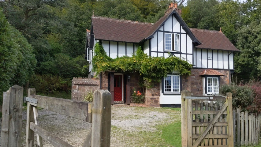 a home with a brown fence around it