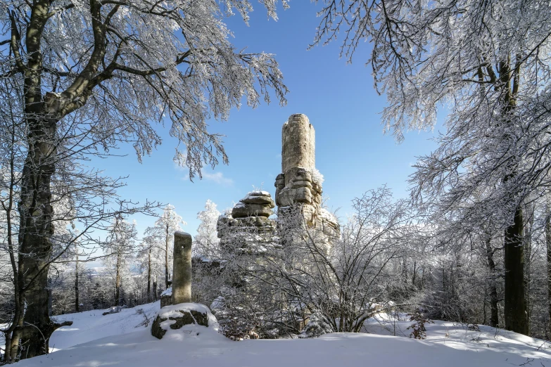 a castle with a tall tower covered in snow