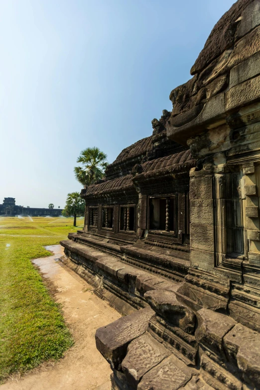 a stone structure with a few wooden benches near by