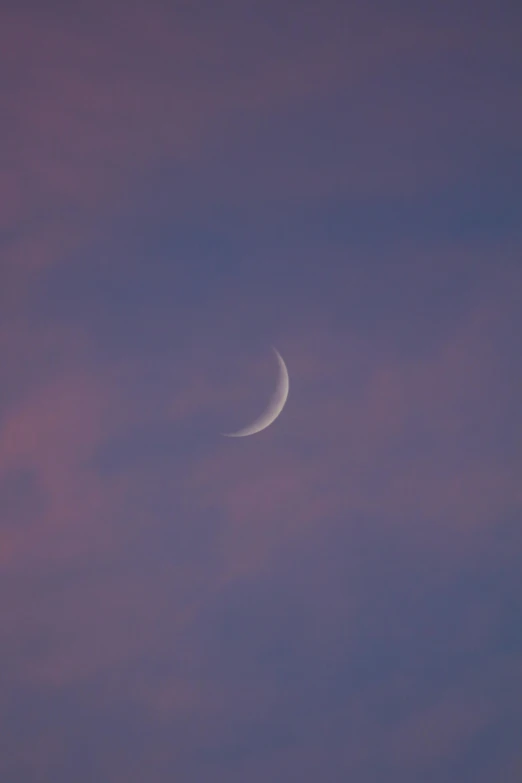 a half - moon and a crescent in the sky