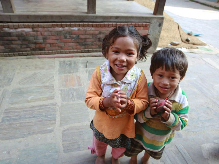 two young children pose for a picture together