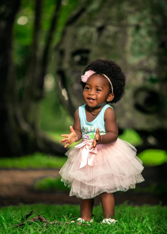 an adorable  dressed in pink and white