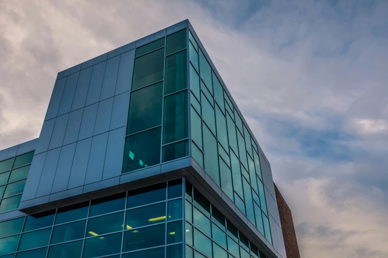 a building with a very large window sitting in the middle of it