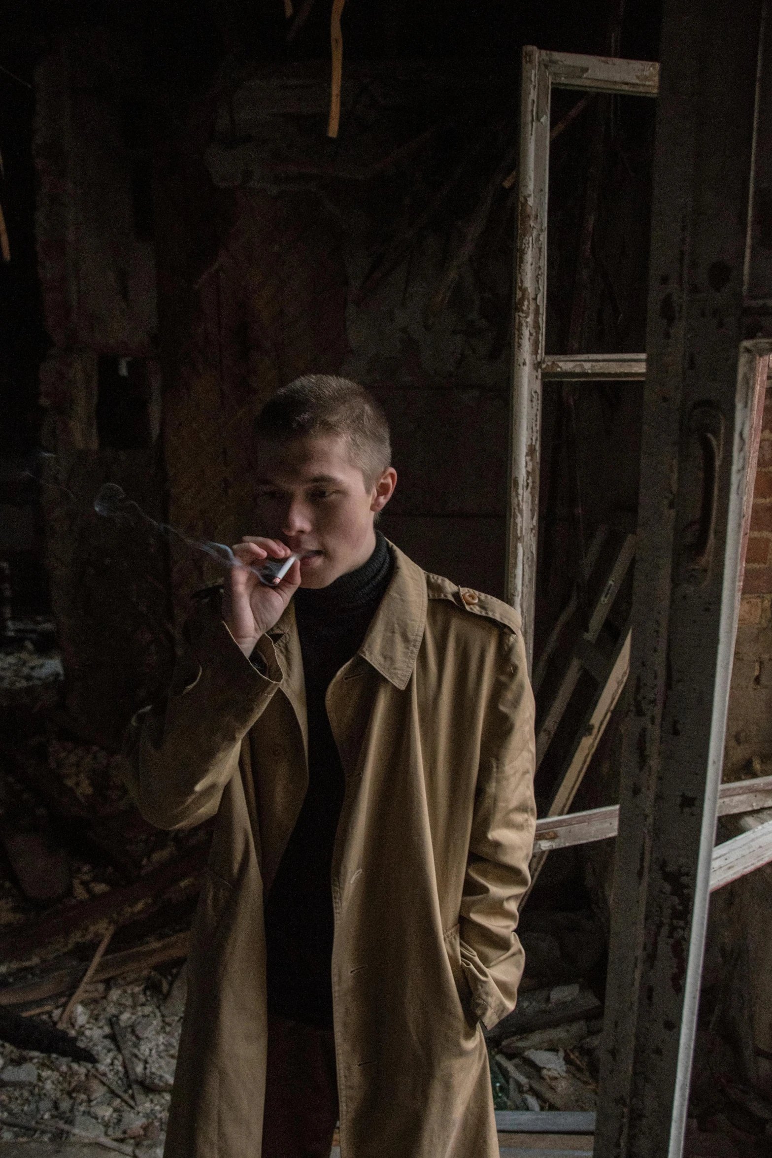 a man in a trench coat is talking on the phone