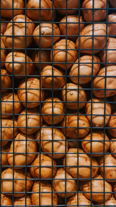lots of nuts that are inside of a mesh basket
