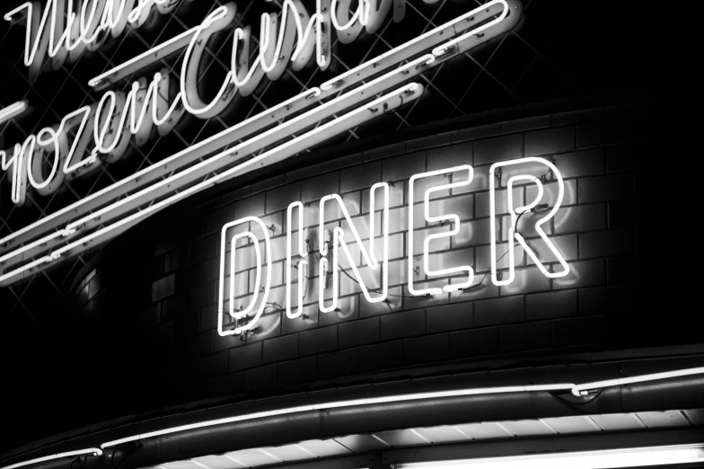 neon sign of diner in black and white