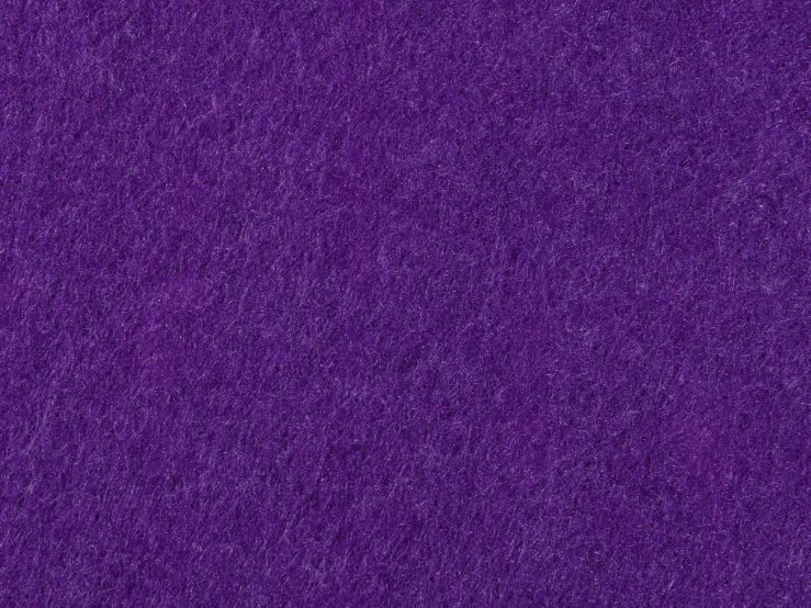 a purple background of some very bright speckled cloth