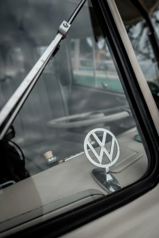 a picture from inside a car window of the rear of the vw