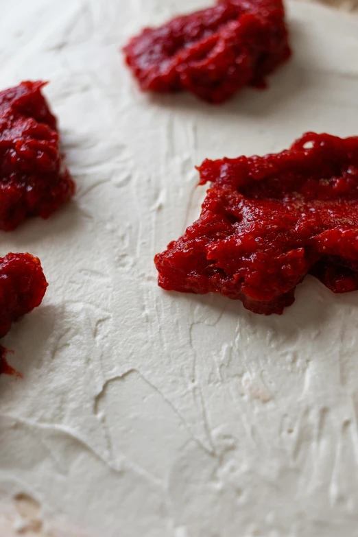 a close up of a dough surface with crumbles