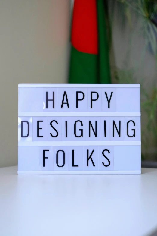 a light box with a message that reads happy designing folks